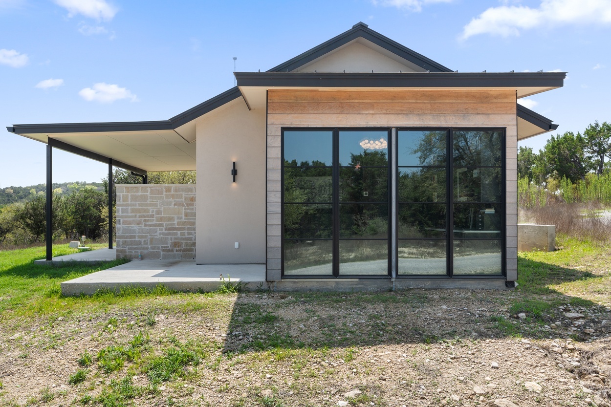 Detached casita by J. Angelo Design Build in Austin, TX featuring natural stonework and modern architectural elements